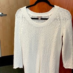 A medium sized white sweater